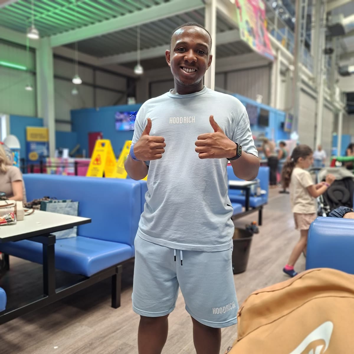 Henry giving two thumbs up on a day out at the trampoline park