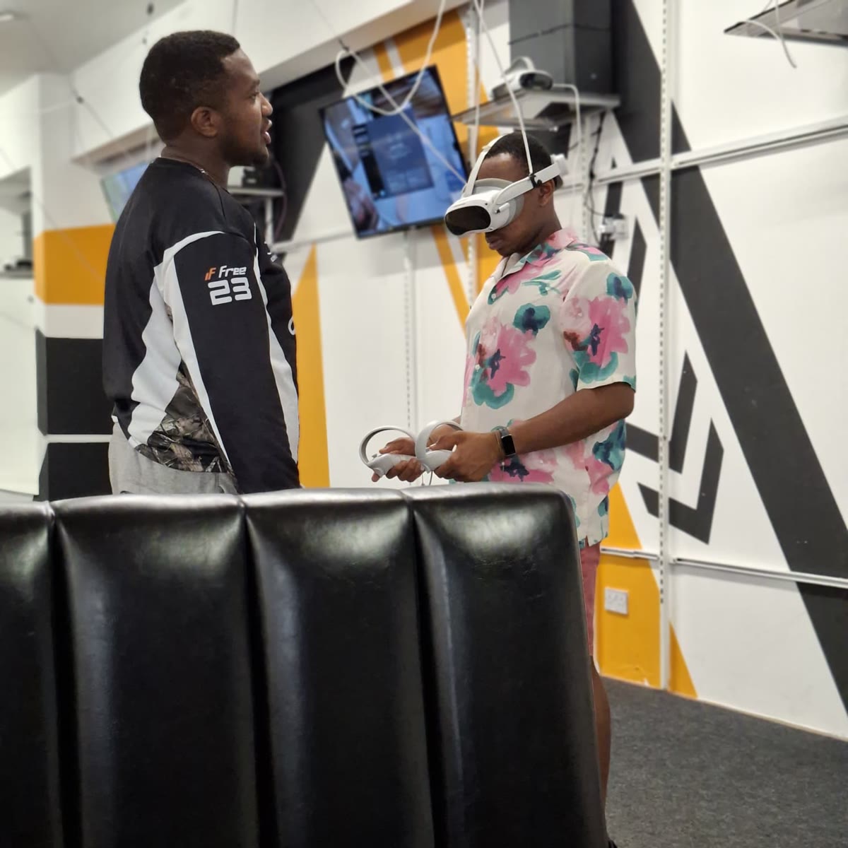 Henry wearing a virtual reality headset and holding controllers